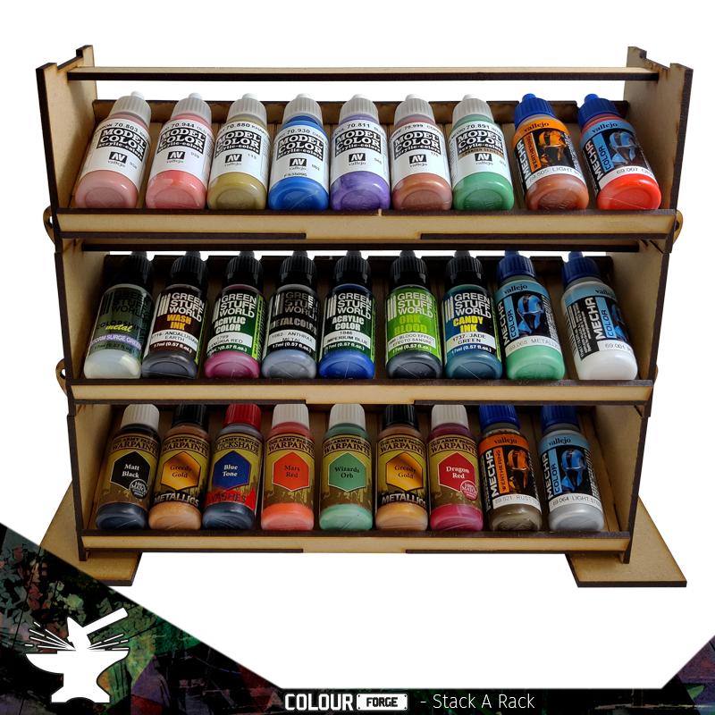 The Stack a Rack is a modular and stackable system for a variety of paints. Dropper bottles, flip top and even larger pigment pots will fit in the stands.The system contains cradles for dropper bottles but enough space for almost all but the largest of paints.This kit contains 3 stacks, each with a set of feet and clips to hold the racks together. These can be assembled and 3 separate kits or 1 larger stack.This rack measures 301mm wide, 100mm deep and each rack is 74mm high.This product is cut from 3mm MDF and requires assembly.Brushes and paints sold separately and shown for illustrative purposes. The Colour Forge Stack a Rack Paint Rack Set (3 tiers) - TCF-ACC-007 - 5060843100706