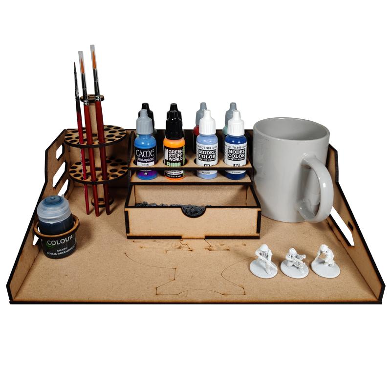 The Compact Hobby Station is an ideal upgrade for your hobby space.Features include:- Paint rack (multiple options provided)- "No Spills" paint pot holder- Mug o' Brush stand- Bitz drawThe kit can be assembled to accommodate dropper bottle or flip top paints. On the left and right there are spaces for the brush stand and a water pot and the kit has been designed for either left or right hand orientation. The Colour Forge Compact Hobby Station - TCF-ACC-008 - 5060843101864
