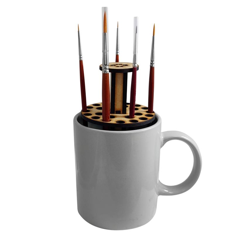 The "Mug o Brush" paint brush stand from The Colour Forge is a great addition to any work bench. Designed to save space and protect your brushes from damage.This kit is made of 3mm MDF which is quick and simple to assemble without compromising on quality. The stand when assembled will fit inside a typical mug to prevent any chance of knocking it over.This kit requires assembly.*mug and brushes not included The Colour Forge Mug o' Brush - Paint Brush Stand - TCF-ACC-002 - 5060843100591